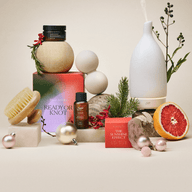 A collection of limited-edition Holiday products arranged among festive decor. 